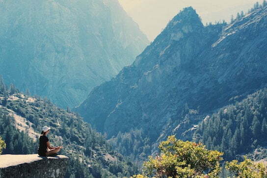 meditating on a mountain