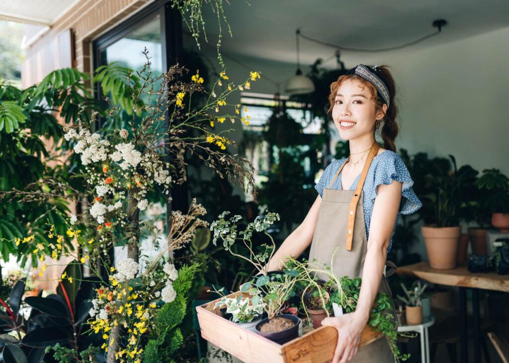 young pretty woman in a plant shop