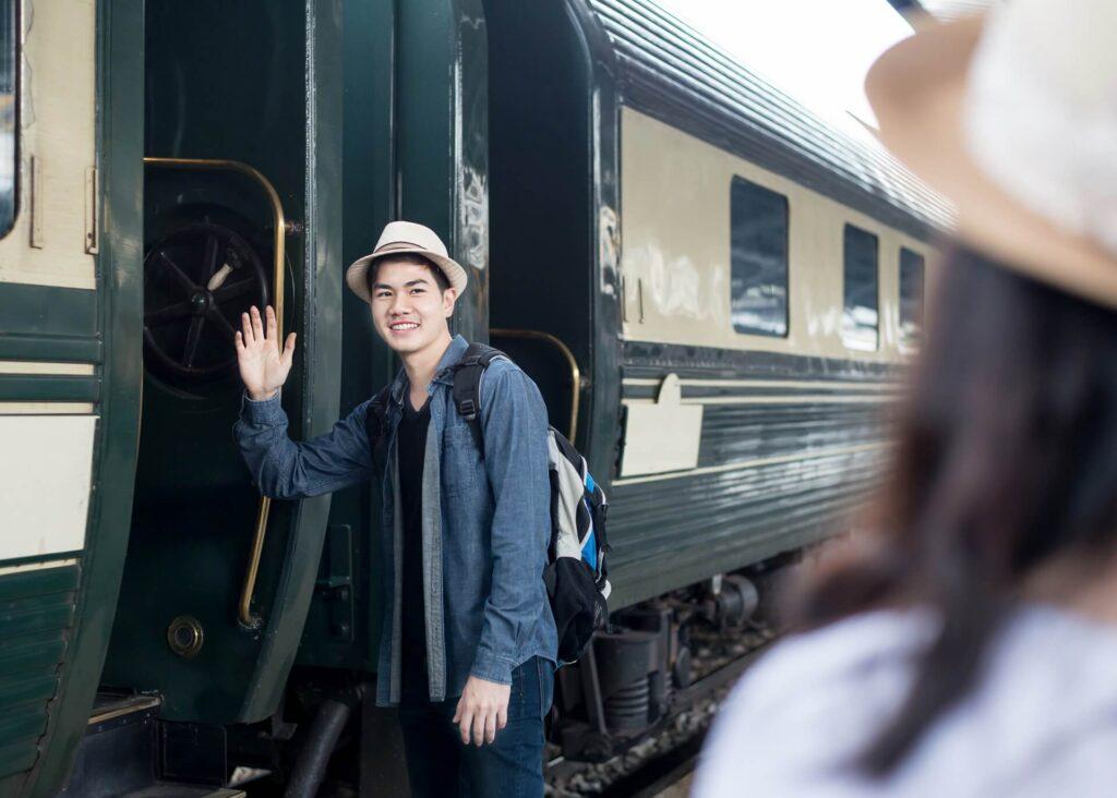 chinese guy saying goodbye before boarding train
