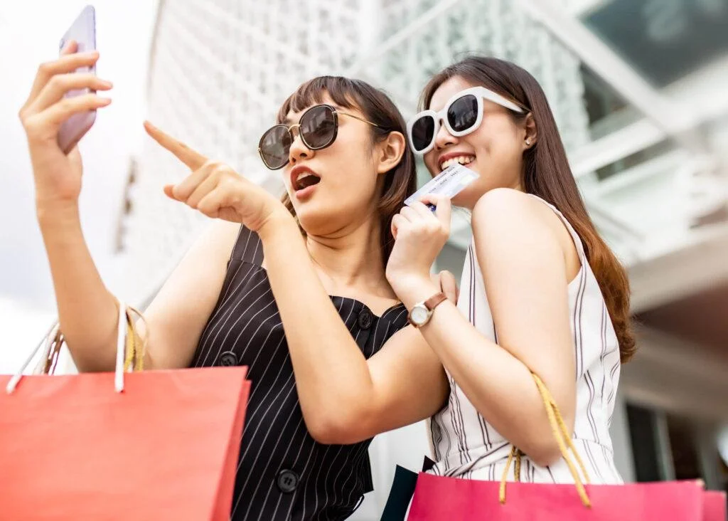 women taking shopping selfies