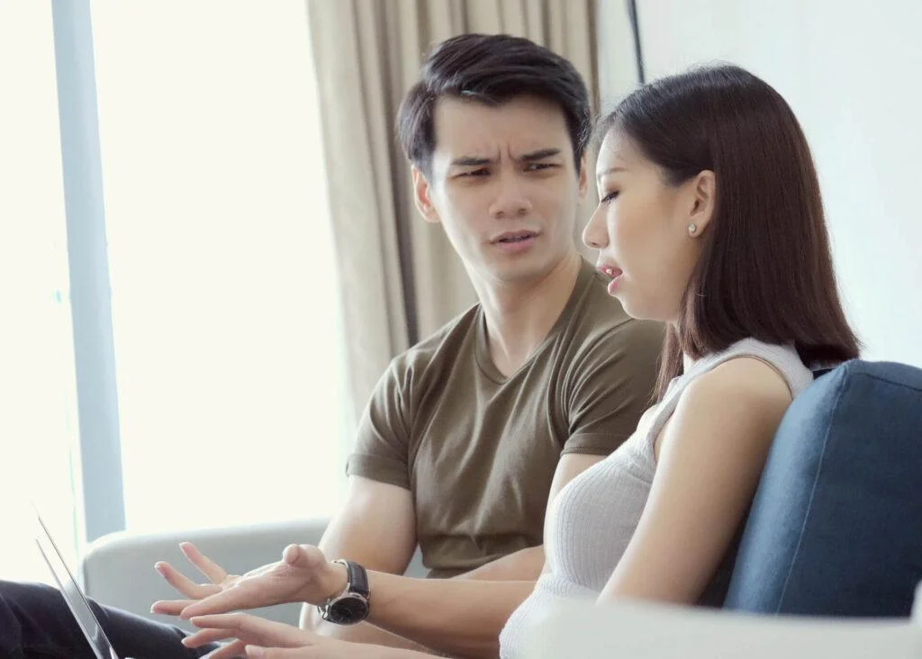 young chinese couple with laptop