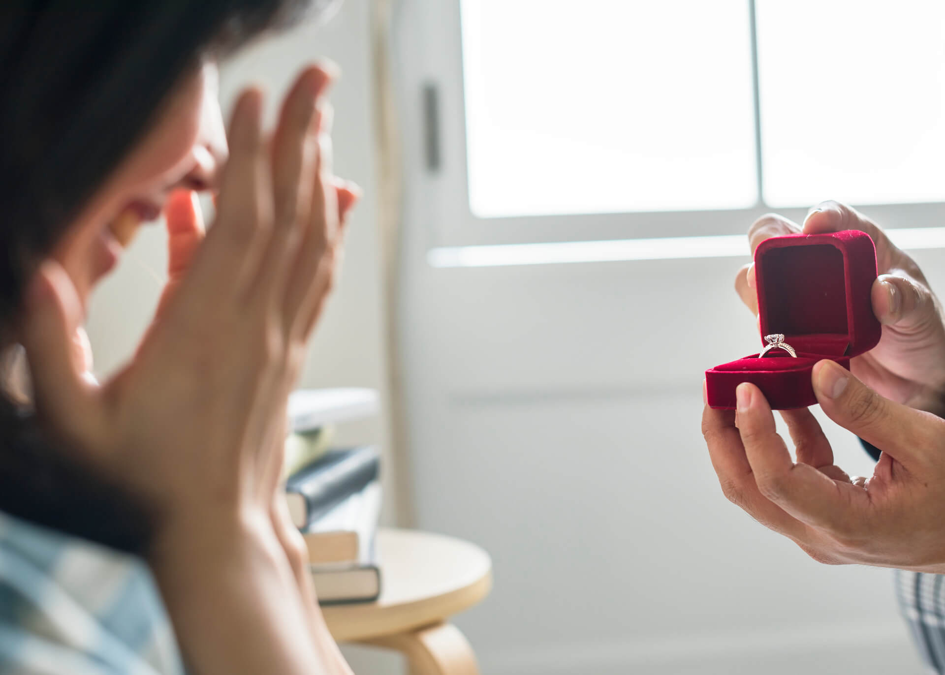 woman surprised with engagement ring