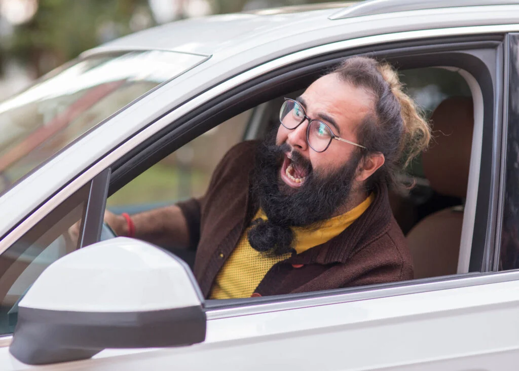 chinese man screaming from a car window