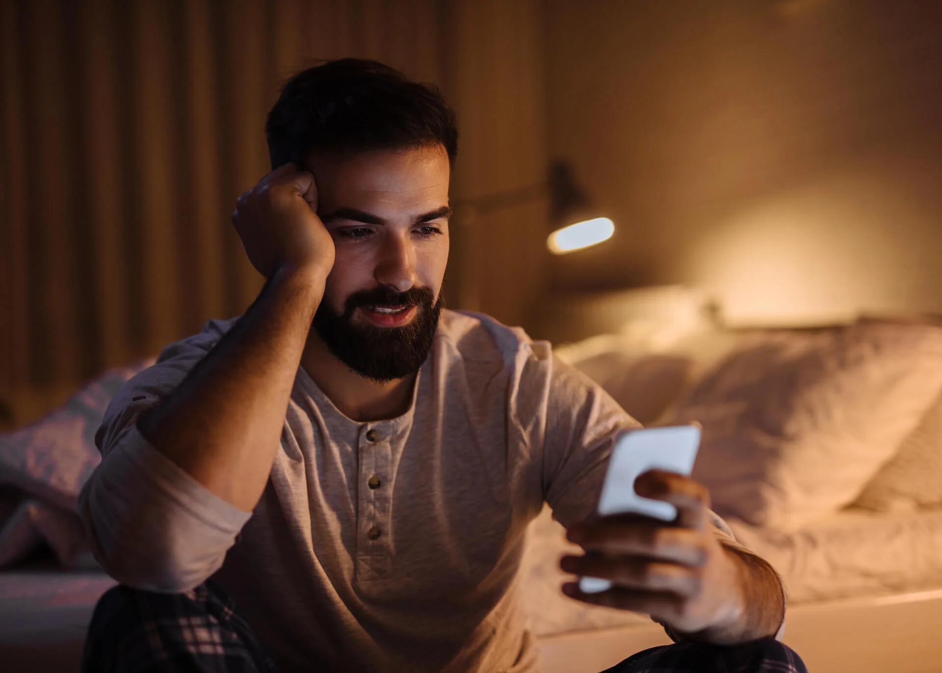 man texting good night on his phone