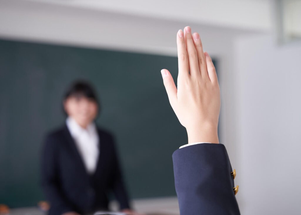 student raising hand