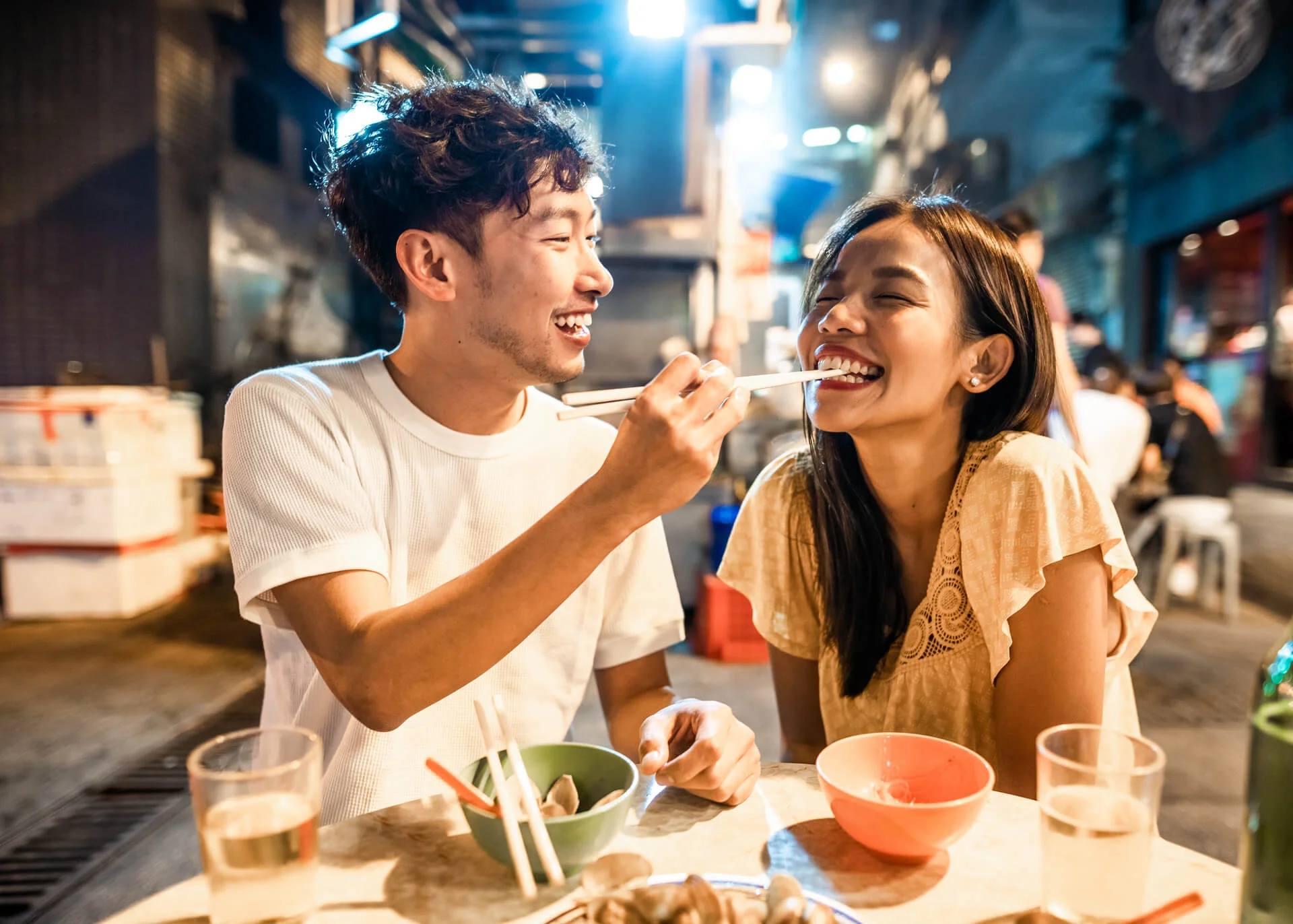 asian couple eating chinese street food