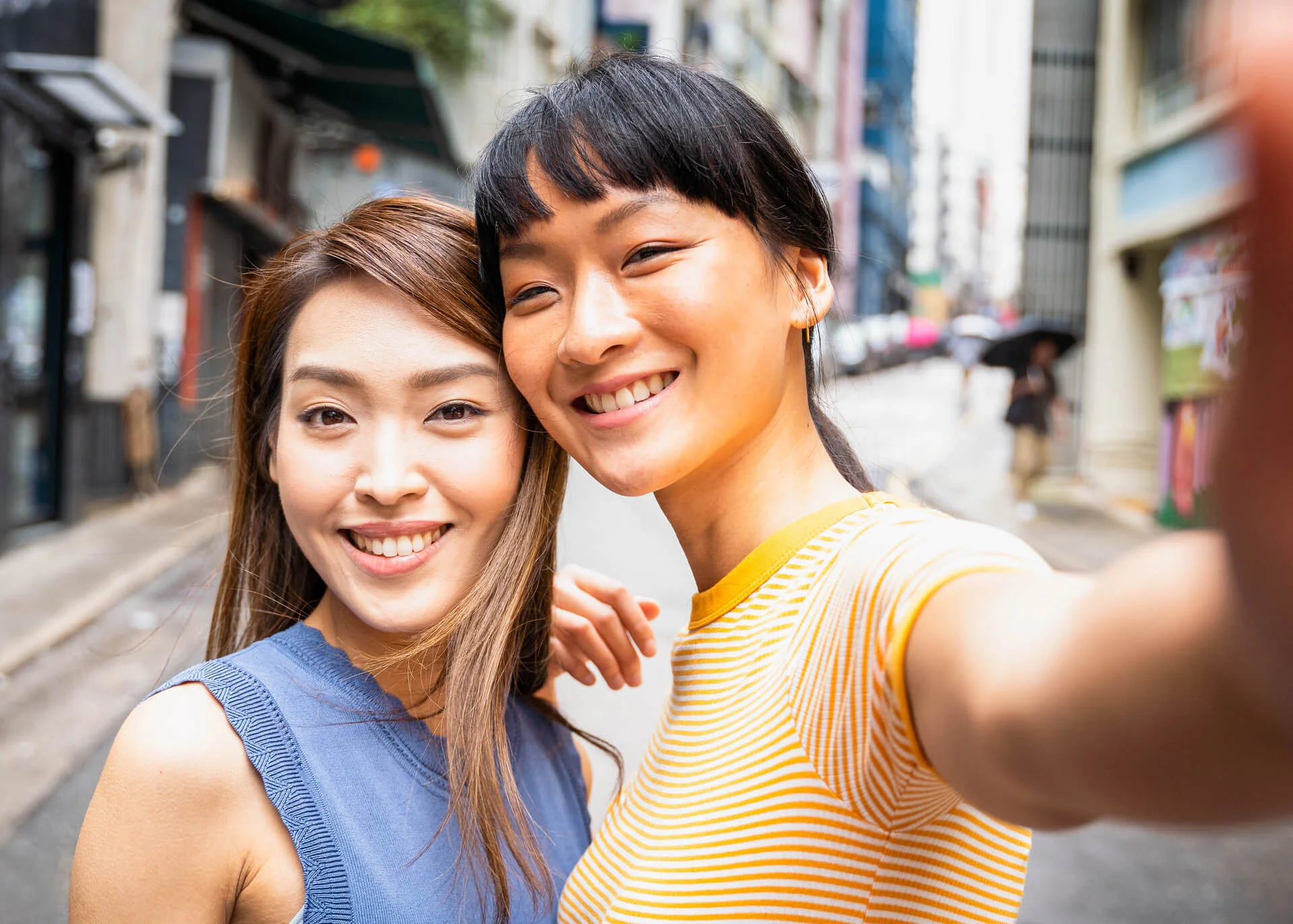 chinese female friends taking selfie