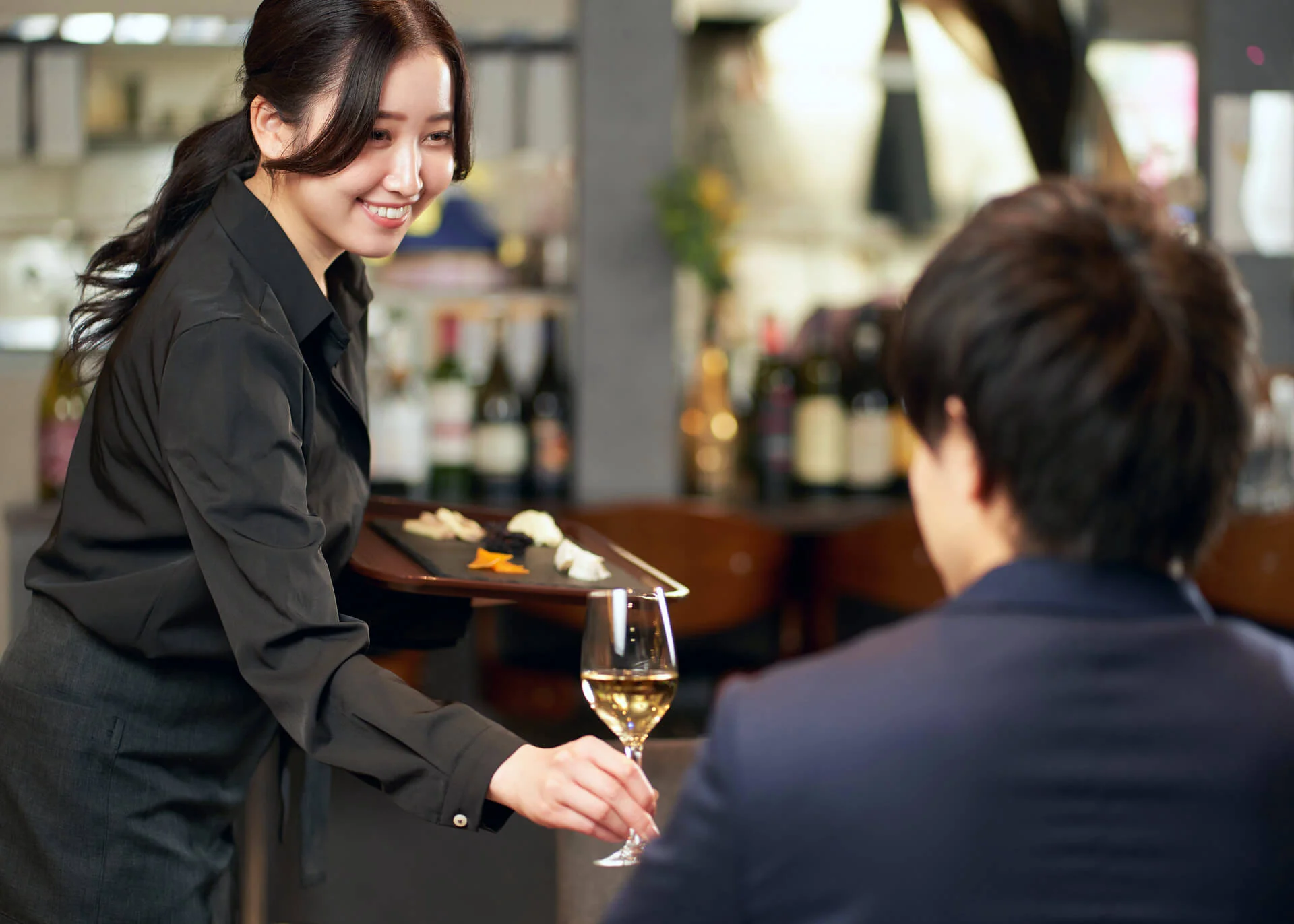 chinese waitress serving customer in a cafe