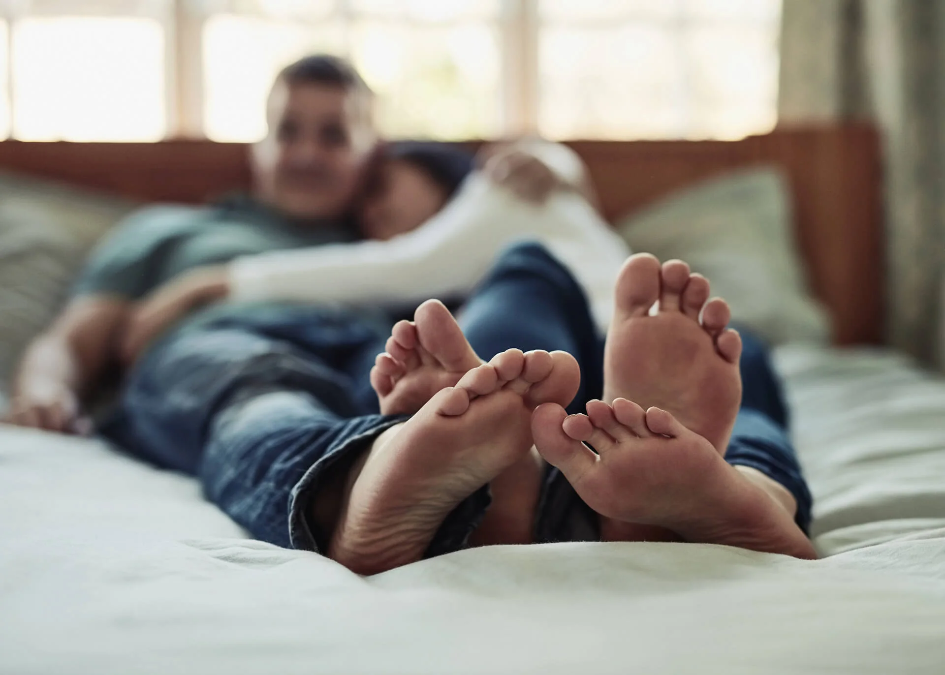 couple snuggling in bed