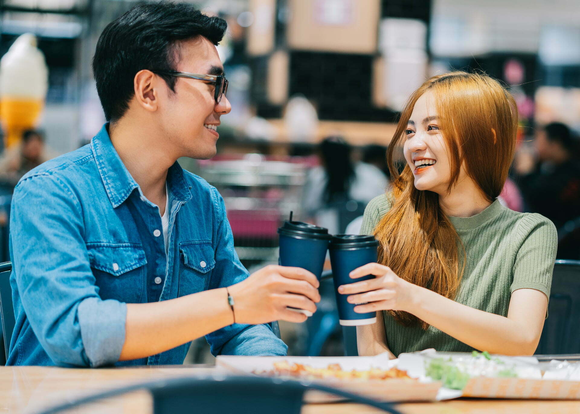 young asian couple drinking coffee
