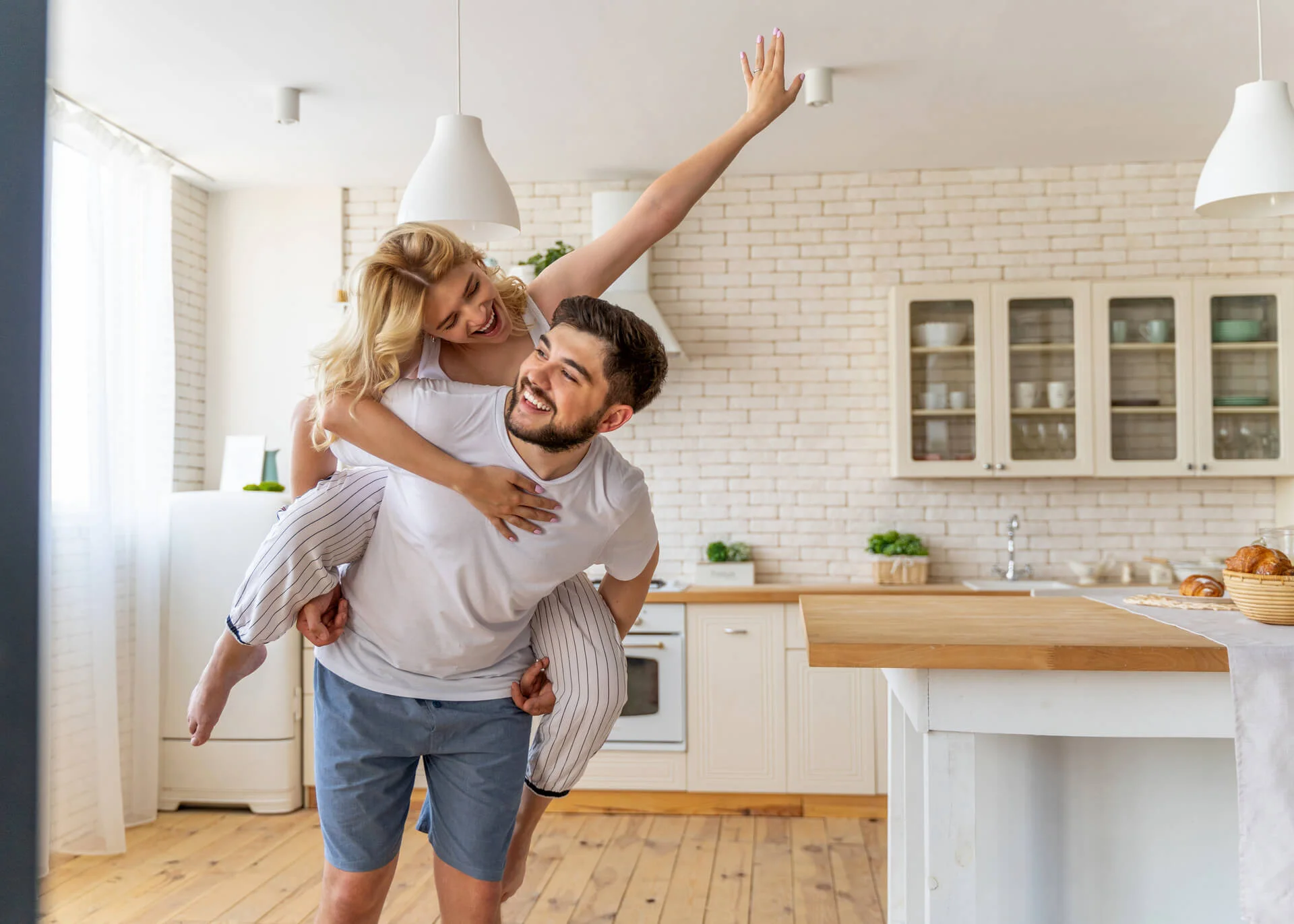 young playful couple at home