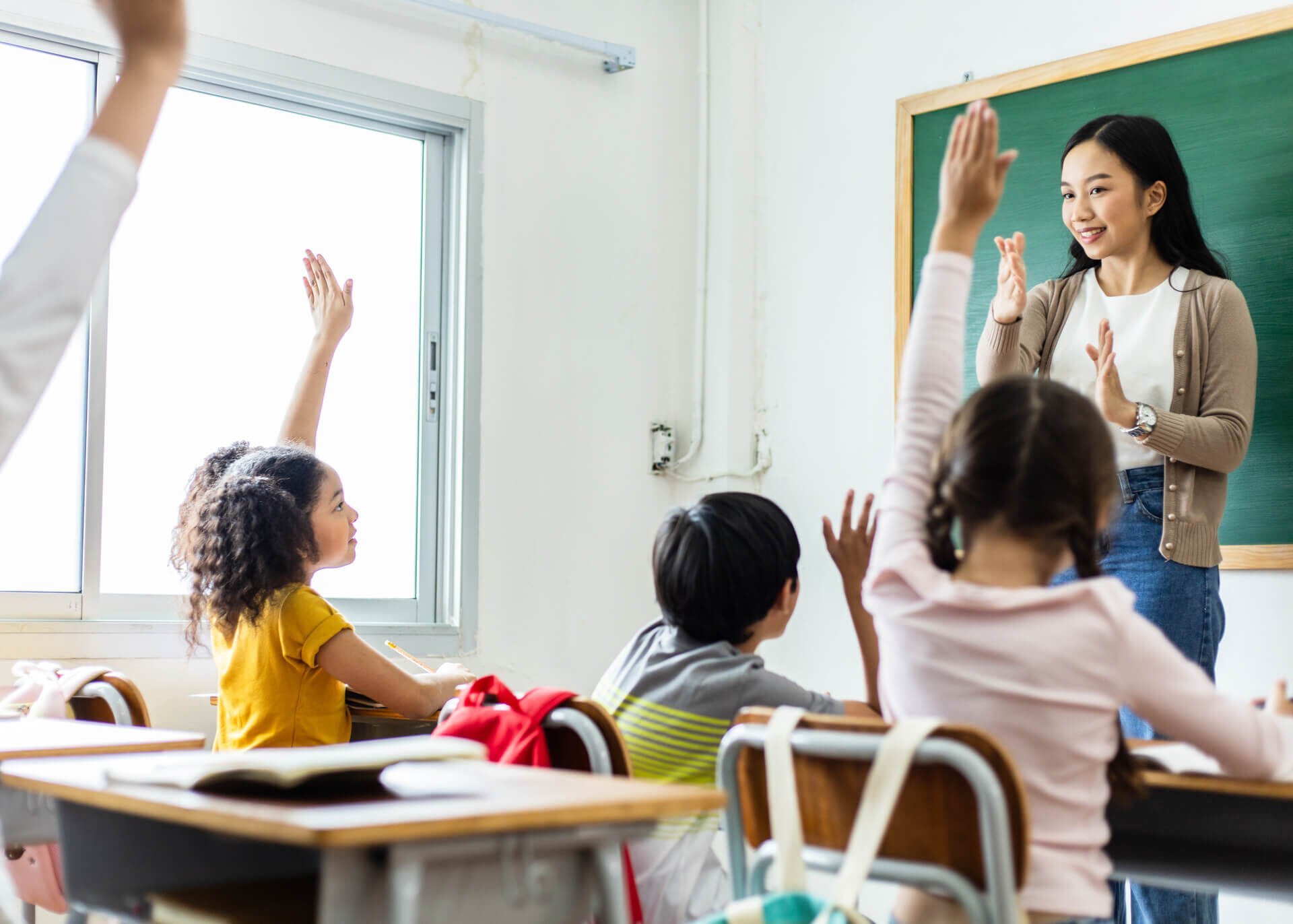 chinese teacher in classroom with students