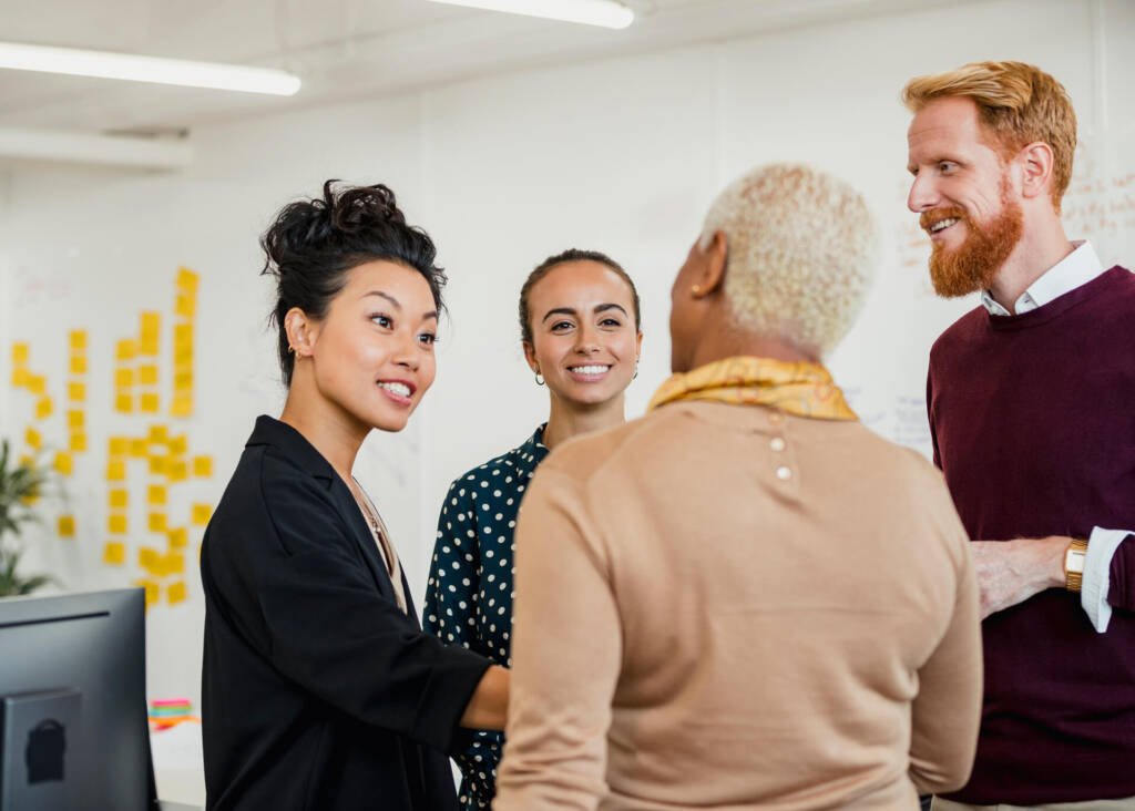 multinational group of people having a conversation