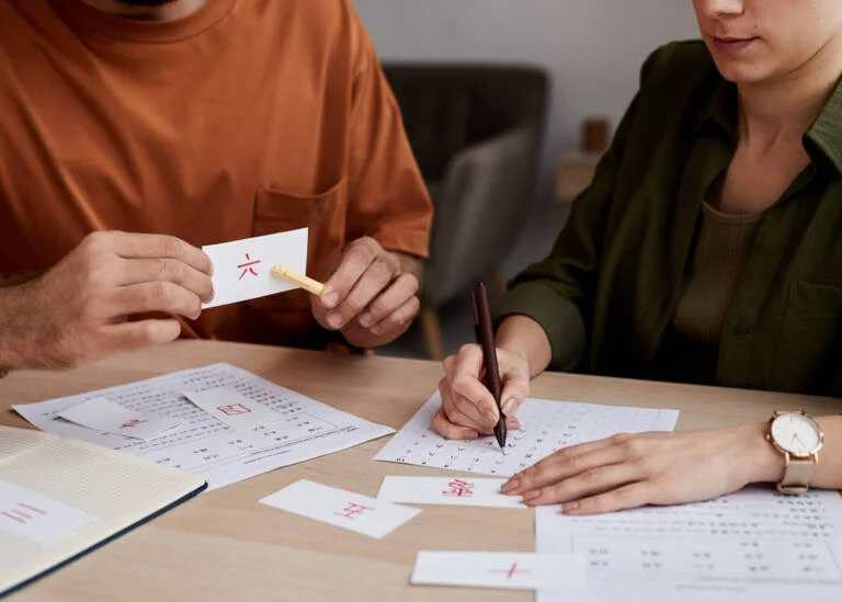 chinese tutor teaching a student