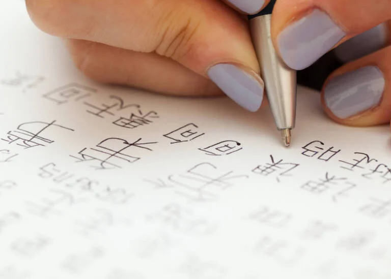 woman writing chinese characters