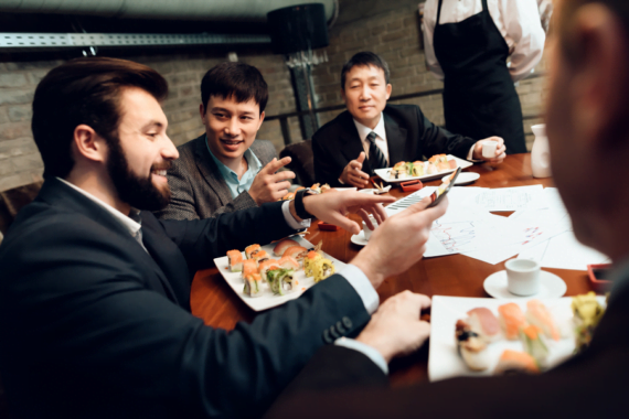 Man having dinner with Chinese colleagues