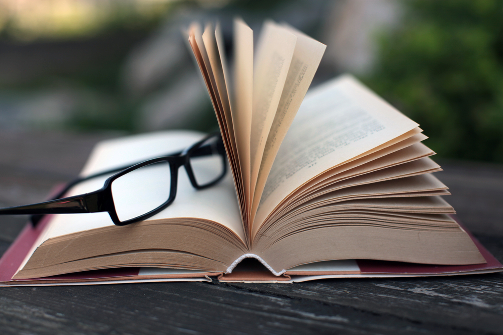 Learning with glasses and book