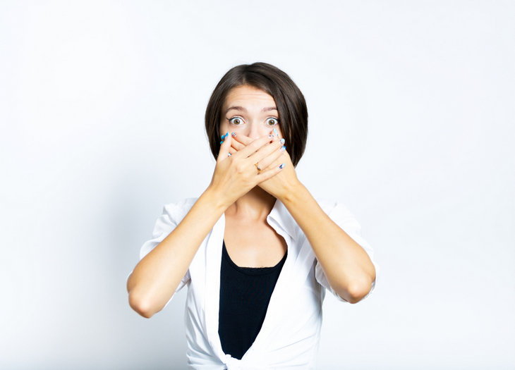 woman-covers-mouth-with-hands-to-prevent-neutral-tone-catastrophes
