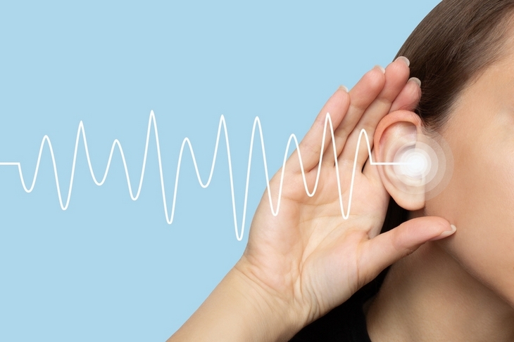 woman-puts-her-hand-on-ear-to-listen-for-neutral-tone