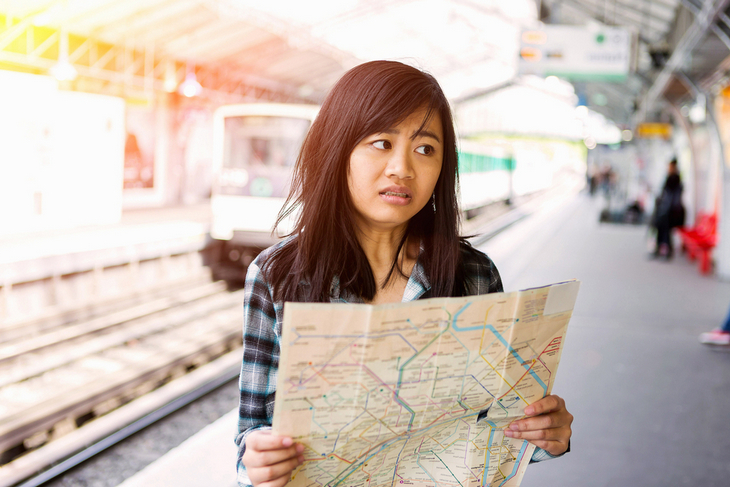 young-attractive-asian-tourist-visiting