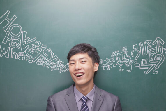 portrait-young-businessman-front-black-board
