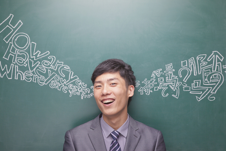 portrait-young-businessman-front-black-board