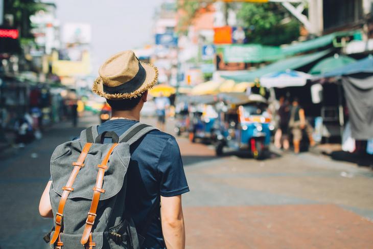 young-asian-traveling-shopping-for-souvenirs