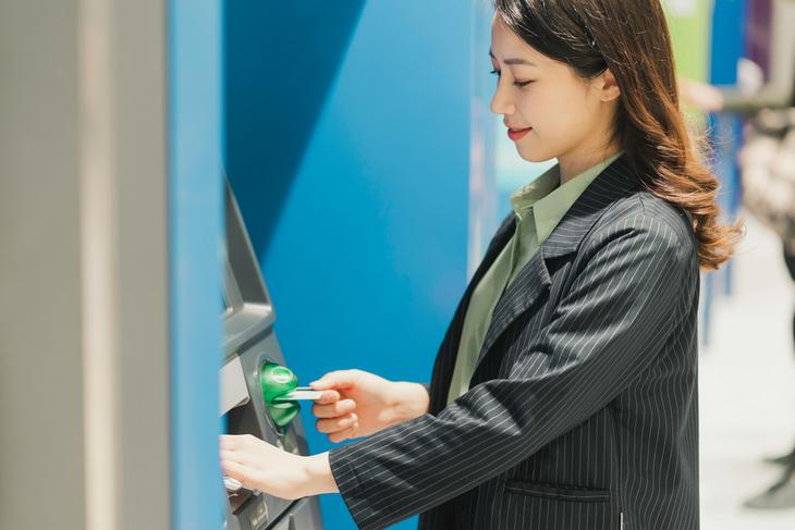 young-girl-withdrawing-money-on-atm