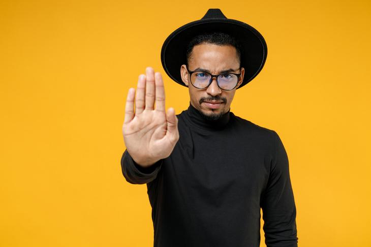 young-strict-serious-african-american-man-wearing-stylish-black-shirt-hat-eyeglasses